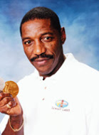 Holding his Gold and Silver Olympic Medals